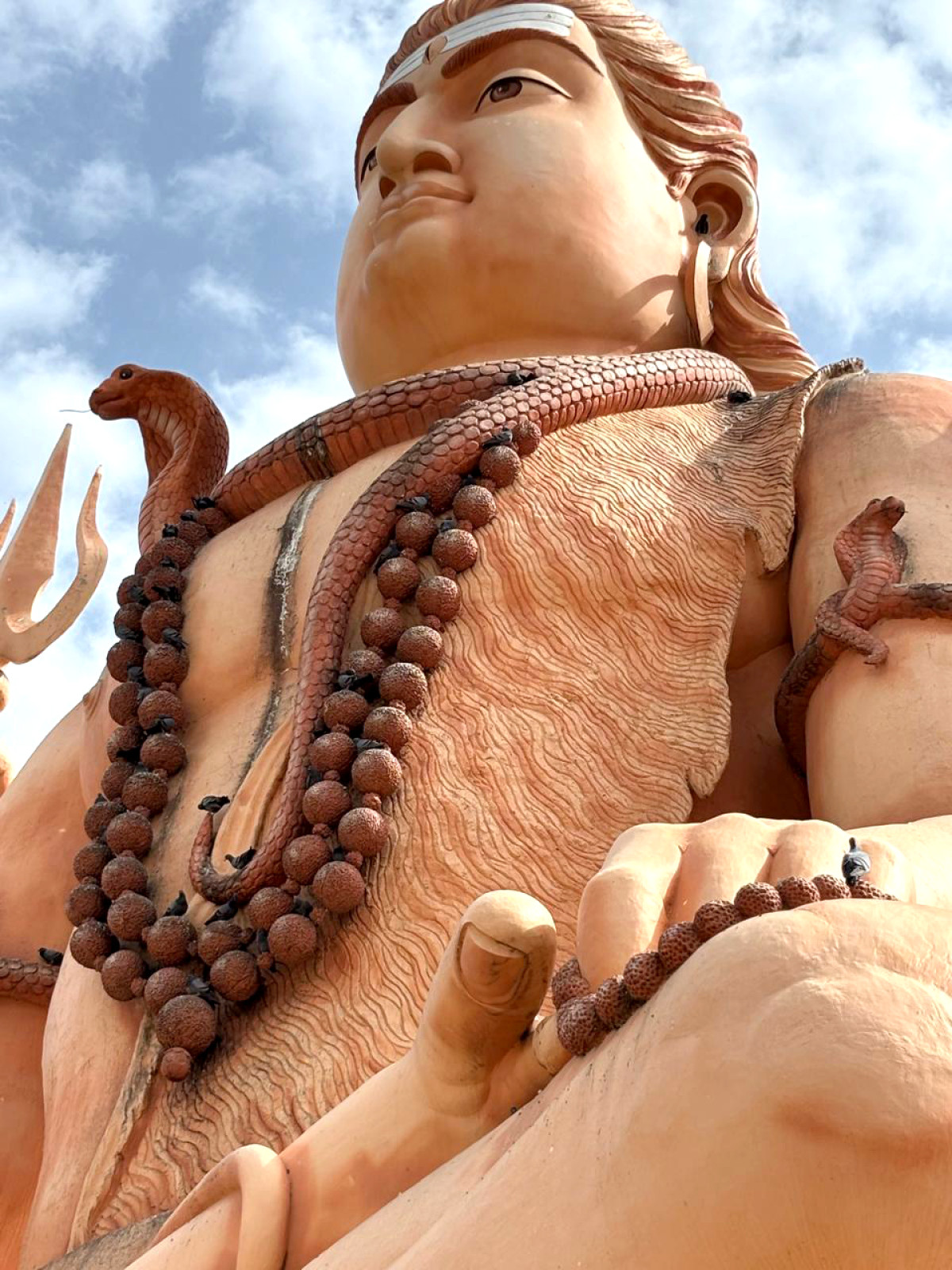 Majestic Lord Shiva statue standing tall under the open sky - a symbol of peace, power, and divine energy